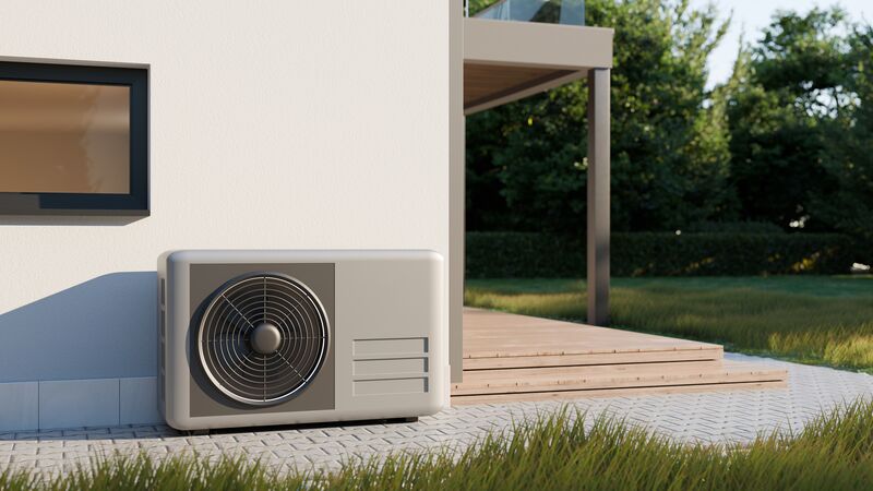 Outdoor mini-split heat pump unit installed at a modern residential home